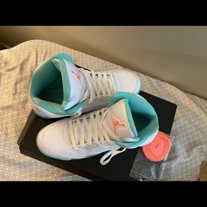 The Jordan 5 peach and aqua hues.